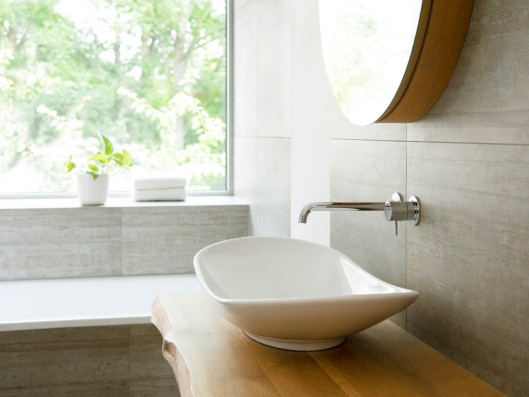 View from a bathroom over the sink to the window outside