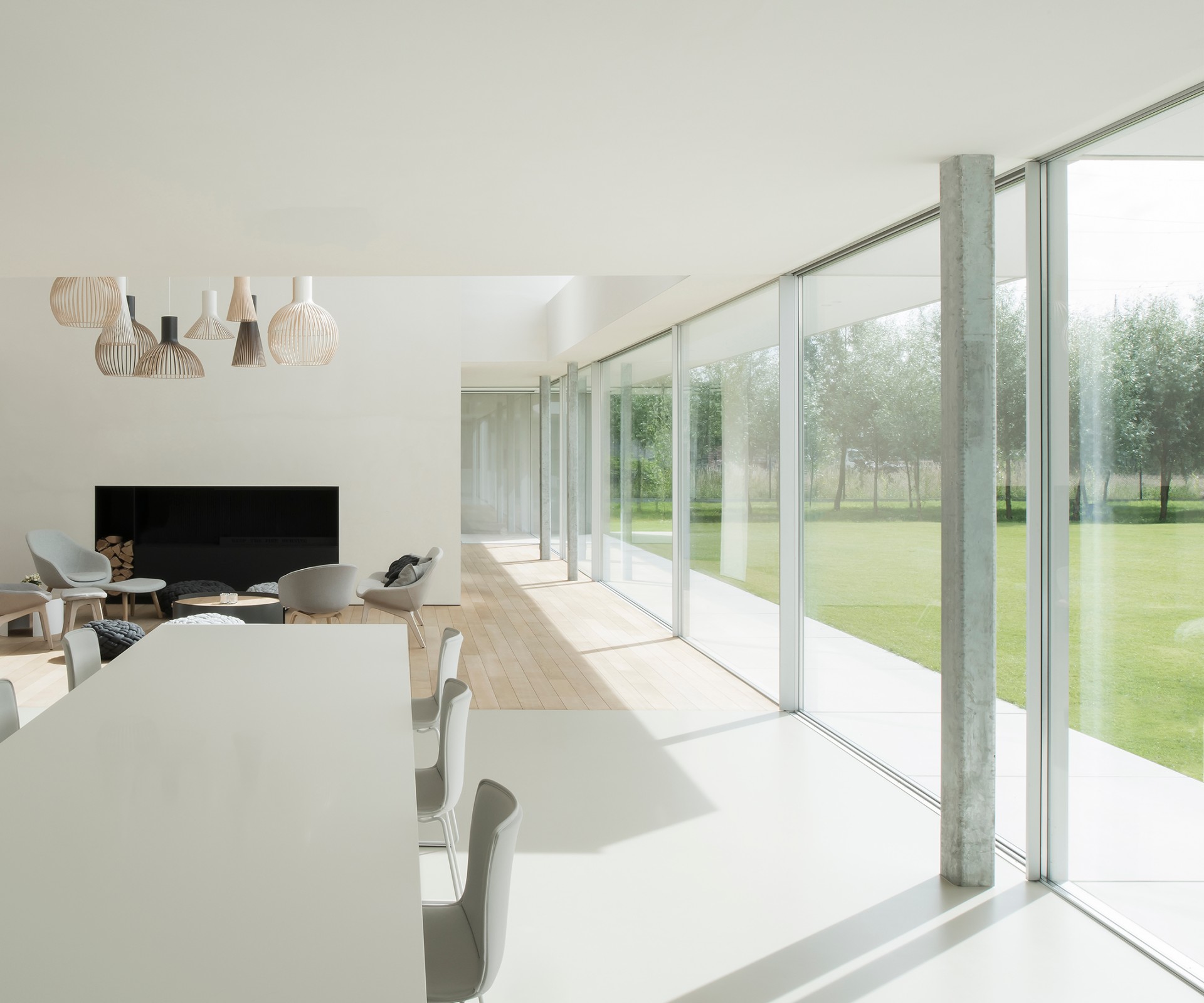Dining table in a modern living room with a large window front